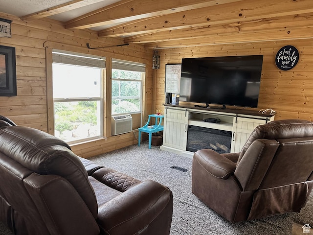 3077 S Edgemont Dr, Garden City, UT 84028 - living area featuring wood walls, carpet flooring, beam ceiling, and cooling unit