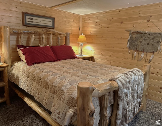 3077 S Edgemont Dr, Garden City, UT 84028 - bedroom featuring carpet flooring and wooden walls