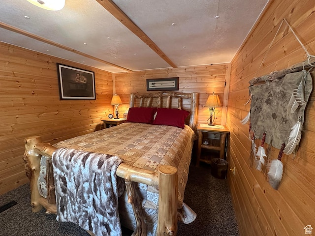 3077 S Edgemont Dr, Garden City, UT 84028 - bedroom featuring wooden walls, carpet flooring, and beam ceiling