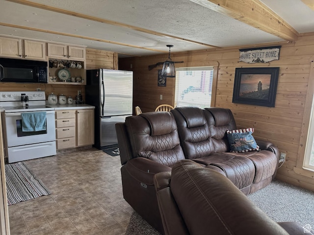 3077 S Edgemont Dr, Garden City, UT 84028 - living room with wooden walls, beam ceiling, and healthy amount of natural light
