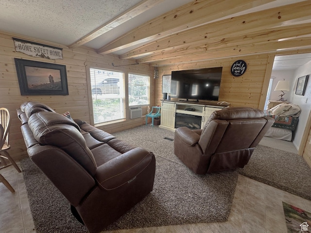 3077 S Edgemont Dr, Garden City, UT 84028 - living room with wood walls, a fireplace, beam ceiling, cooling unit, and a textured ceiling