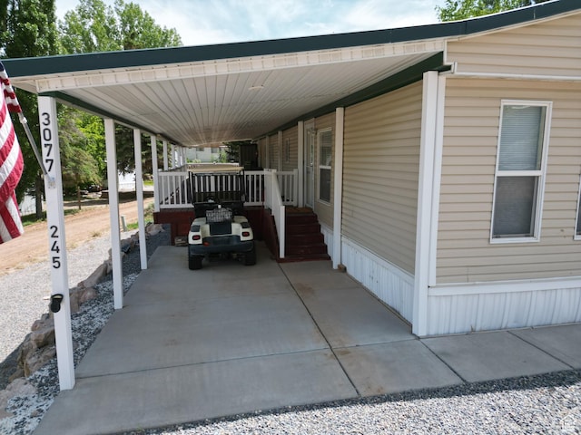 3077 S Edgemont Dr, Garden City, UT 84028 - view of parking featuring an attached carport