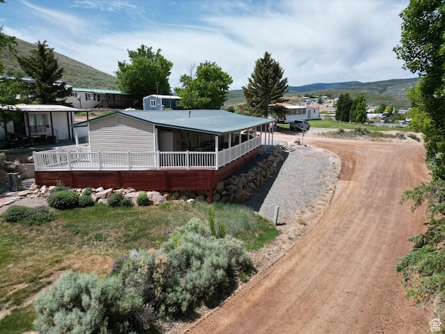 3077 S Edgemont Dr, Garden City, UT 84028 - rear view of property with a mountain view