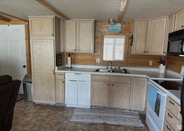 3077 S Edgemont Dr, Garden City, UT 84028 - kitchen with white range with electric stovetop, black microwave, wooden walls, light brown cabinetry, and beamed ceiling