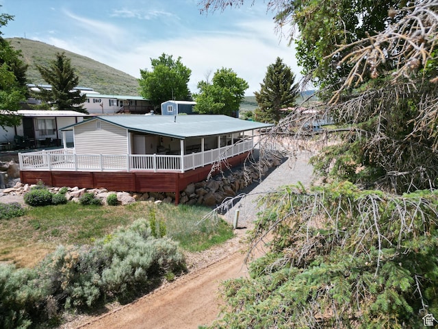 3077 S Edgemont Dr, Garden City, UT 84028 - rear view of house featuring a mountain view