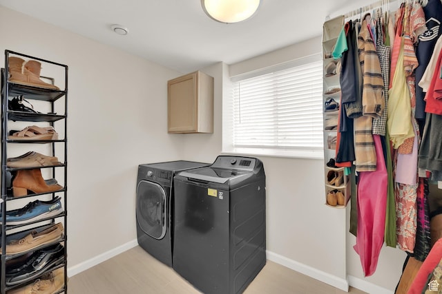 5318 S 4300 W, Hooper, UT 84315 - laundry area featuring washing machine and clothes dryer, cabinet space, and light wood-style floors