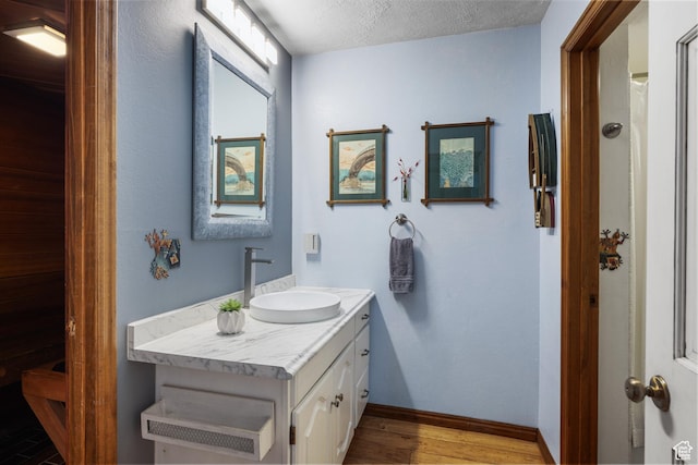 1035 Park Ave Unit 7-G, Park City, UT 84060 - full bath with vanity, wood finished floors, and a textured ceiling