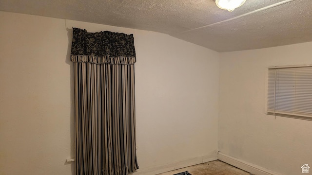 358 E 11th St, Ogden, UT 84404 - unfurnished room featuring vaulted ceiling and baseboards