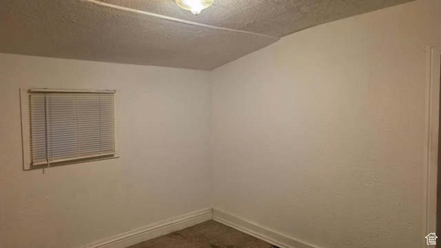 358 E 11th St, Ogden, UT 84404 - spare room with baseboards and dark colored carpet