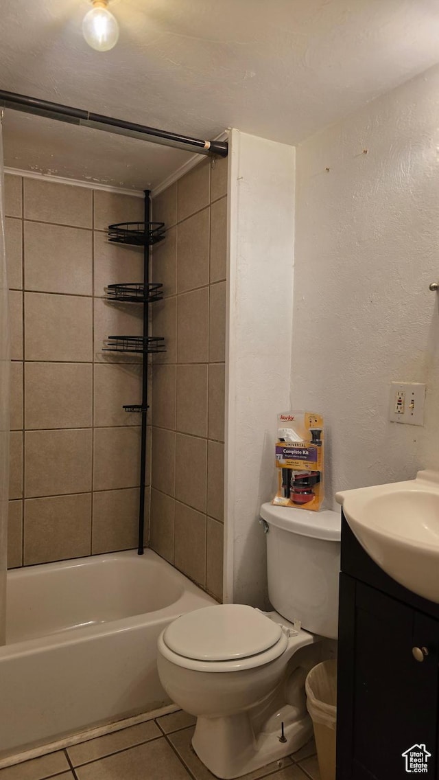 358 E 11th St, Ogden, UT 84404 - bathroom with tile patterned floors, vanity,  shower combination, and a textured wall