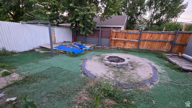 358 E 11th St, Ogden, UT 84404 - fenced backyard with a fire pit