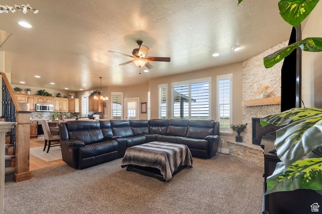 3535 W Overlook Dr, Layton, UT 84041 - living area with a fireplace, a ceiling fan, recessed lighting, light colored carpet, and a textured ceiling