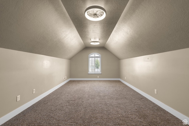 3535 W Overlook Dr, Layton, UT 84041 - additional living space with a textured ceiling, carpet, and vaulted ceiling