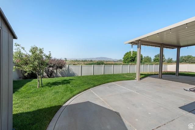 3535 W Overlook Dr, Layton, UT 84041 - fenced backyard featuring a patio and a mountain view
