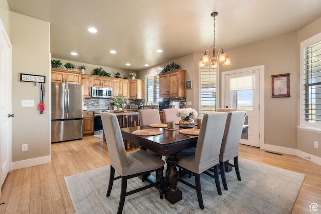 3535 W Overlook Dr, Layton, UT 84041 - dining room featuring recessed lighting, a chandelier, and light wood-type flooring