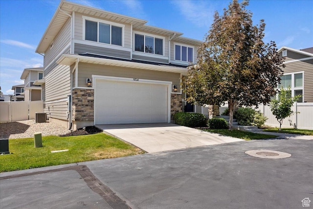 9714 S Oia Ln W, South Jordan, UT 84095 - view of front facade with a garage, driveway, and stone siding