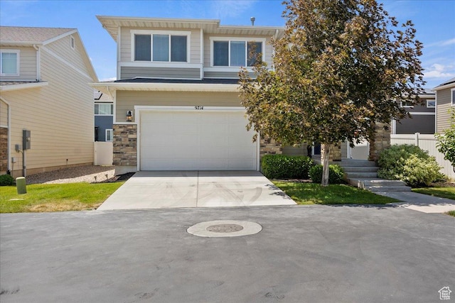 9714 S Oia Ln W, South Jordan, UT 84095 - view of front of property with a garage, concrete driveway, and stone siding
