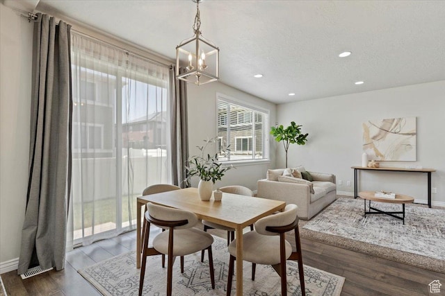 9714 S Oia Ln W, South Jordan, UT 84095 - dining space featuring a chandelier, recessed lighting, wood finished floors, and a textured ceiling