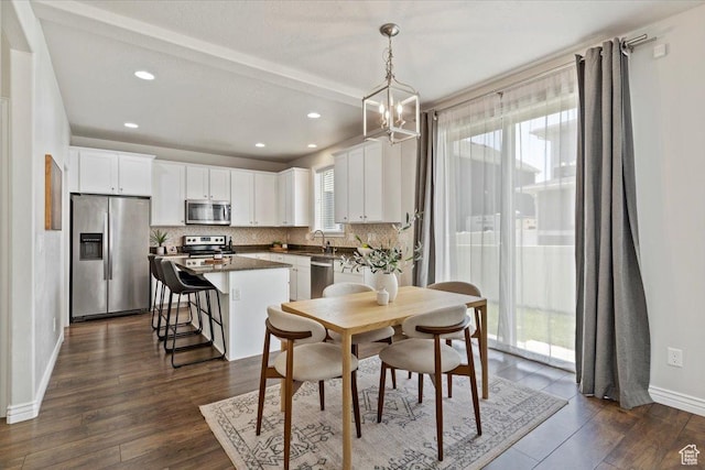 9714 S Oia Ln W, South Jordan, UT 84095 - dining area with recessed lighting, dark wood-type flooring, and a chandelier