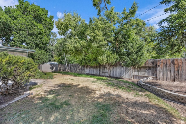 1731 E 1460 N, Logan, UT 84341 - fenced backyard featuring a storage unit