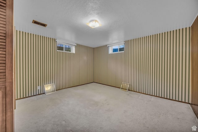1731 E 1460 N, Logan, UT 84341 - carpeted empty room featuring a textured ceiling and healthy amount of natural light