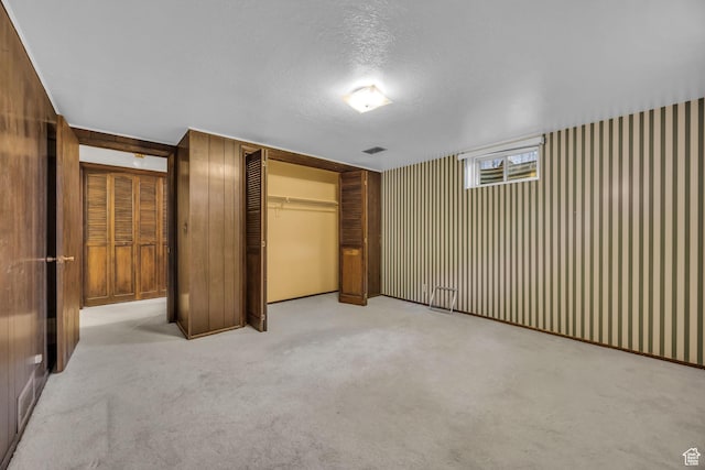 1731 E 1460 N, Logan, UT 84341 - unfurnished bedroom with a closet, carpet, and a textured ceiling
