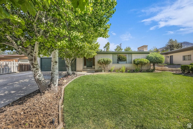 1731 E 1460 N, Logan, UT 84341 - view of front of property with brick siding, concrete driveway, and a chimney