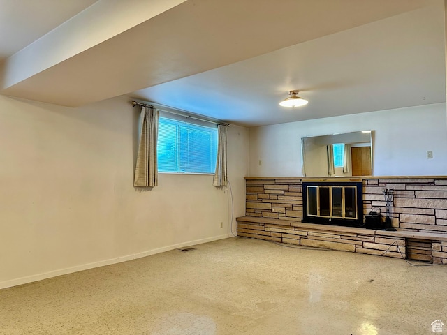 372 E 800 N, Logan, UT 84321 - unfurnished living room with plenty of natural light and a stone fireplace