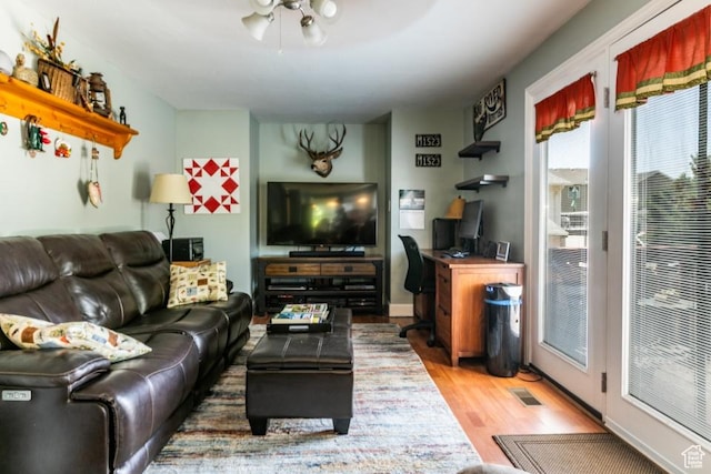 5668 S 1090 W, Murray, UT 84123 - living area featuring wood finished floors and an office area