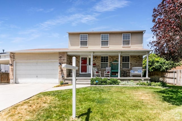 5668 S 1090 W, Murray, UT 84123 - view of front of property with a garage, concrete driveway, covered porch, and brick siding