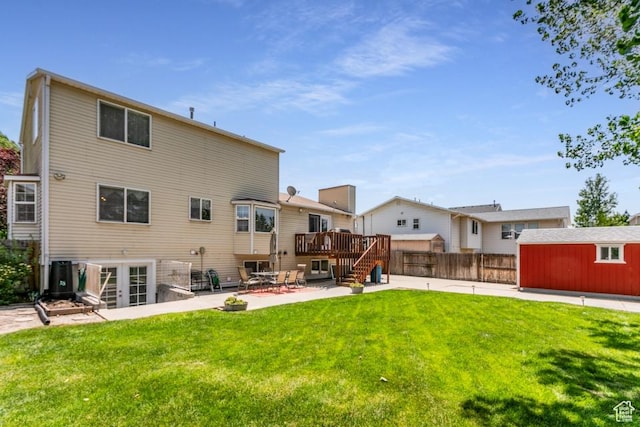5668 S 1090 W, Murray, UT 84123 - back of property featuring a patio, a deck, an outbuilding, and french doors