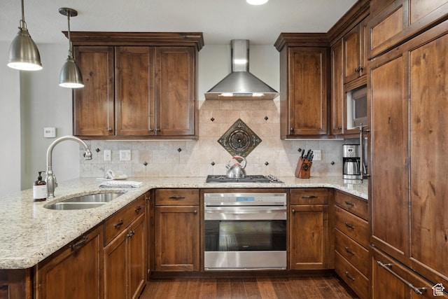 3558 Escala Ct Unit 252, Park City, UT 84098 - kitchen featuring stainless steel appliances, wall chimney range hood, backsplash, and light stone countertops