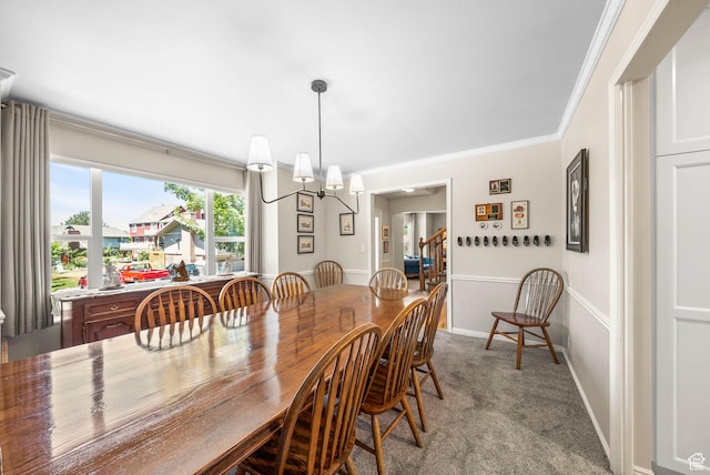 1700 N Bluebird Rd, Orem, UT 84097 - dining room with carpet flooring, a chandelier, and ornamental molding