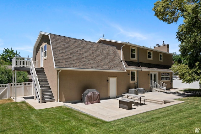 1700 N Bluebird Rd, Orem, UT 84097 - rear view of property featuring stucco siding, stairway, a patio area, a chimney, and roof with shingles
