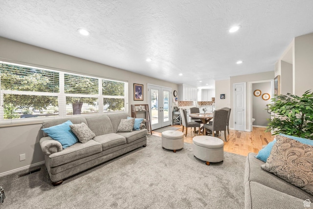 1700 N Bluebird Rd, Orem, UT 84097 - living area featuring recessed lighting, a textured ceiling, light wood finished floors, and french doors