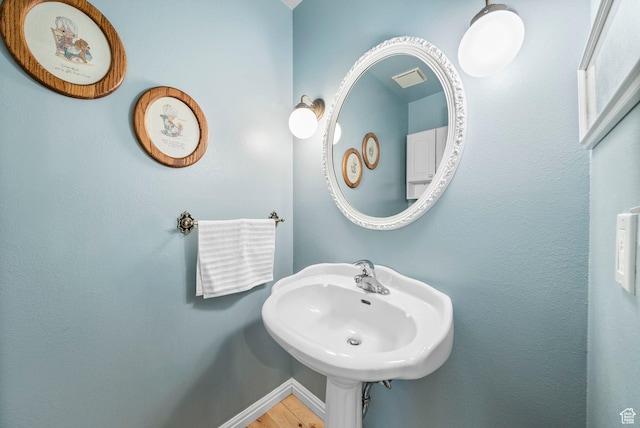1700 N Bluebird Rd, Orem, UT 84097 - bathroom featuring a sink and wood finished floors