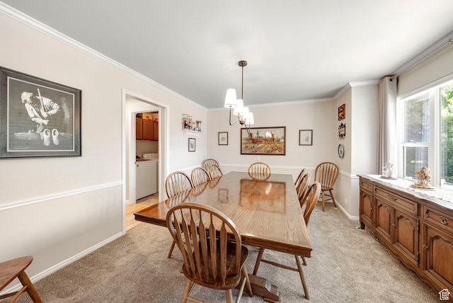 1700 N Bluebird Rd, Orem, UT 84097 - dining room featuring light carpet, crown molding, a chandelier, and washing machine and clothes dryer