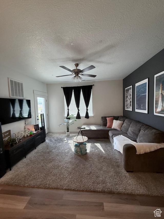 13547 S Hanley Ln Unit 202, Riverton, UT 84096 - living room with a textured ceiling, wood finished floors, and a ceiling fan