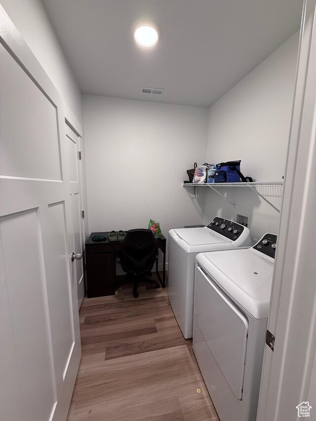 13547 S Hanley Ln Unit 202, Riverton, UT 84096 - laundry area with independent washer and dryer and light wood-style flooring