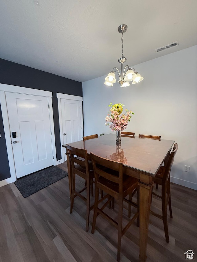 13547 S Hanley Ln Unit 202, Riverton, UT 84096 - dining area with dark wood-type flooring and a chandelier