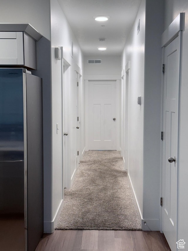 13547 S Hanley Ln Unit 202, Riverton, UT 84096 - corridor featuring wood finished floors and baseboards
