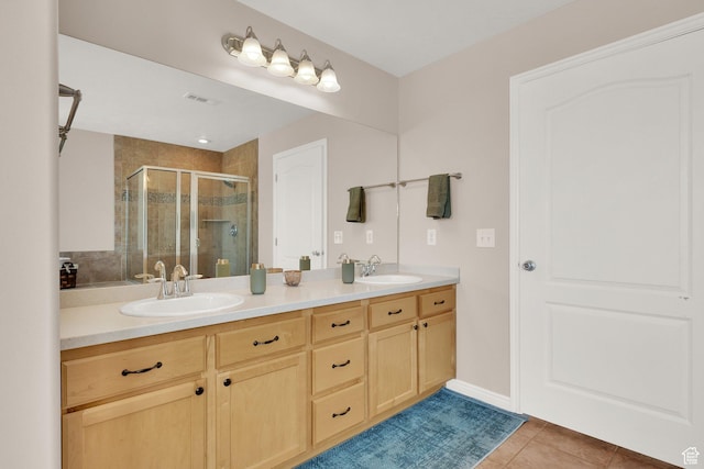 923 E Absaroka Ct S, Draper, UT 84020 - bathroom featuring a stall shower, double vanity, and tile patterned floors