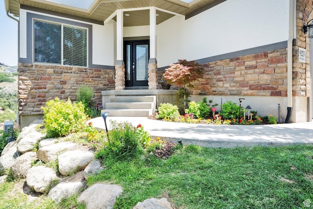 923 E Absaroka Ct S, Draper, UT 84020 - doorway to property with stone siding and stucco siding