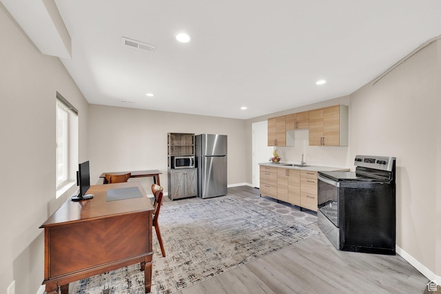 923 E Absaroka Ct S, Draper, UT 84020 - kitchen featuring stainless steel appliances, light brown cabinets, light wood-style floors, light countertops, and recessed lighting