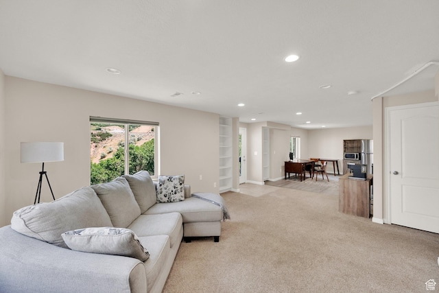 923 E Absaroka Ct S, Draper, UT 84020 - living room with light colored carpet, recessed lighting, and built in features