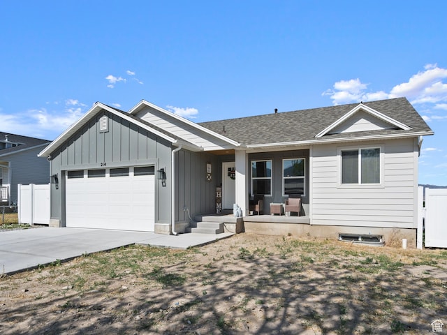 214 S 900 W, Tooele, UT 84074 - ranch-style home with a garage, board and batten siding, driveway, a porch, and roof with shingles