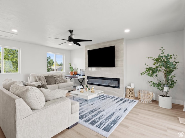 214 S 900 W, Tooele, UT 84074 - living room with plenty of natural light, wood finished floors, a large fireplace, recessed lighting, and a ceiling fan