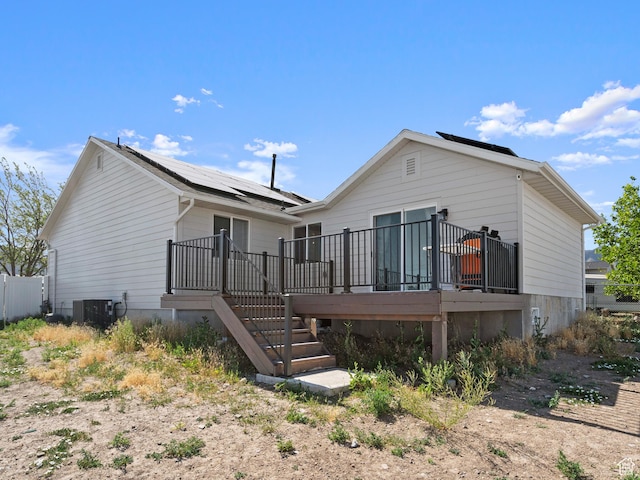 214 S 900 W, Tooele, UT 84074 - back of house featuring roof mounted solar panels, a wooden deck, and stairs