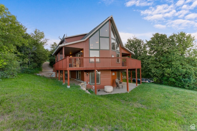 1340 N Trapper Loop, Garden City, UT 84028 - rear view of property featuring a patio area, a yard, and a deck