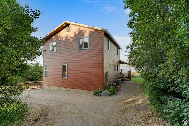 1340 N Trapper Loop, Garden City, UT 84028 - view of property exterior featuring dirt driveway and a cooling unit